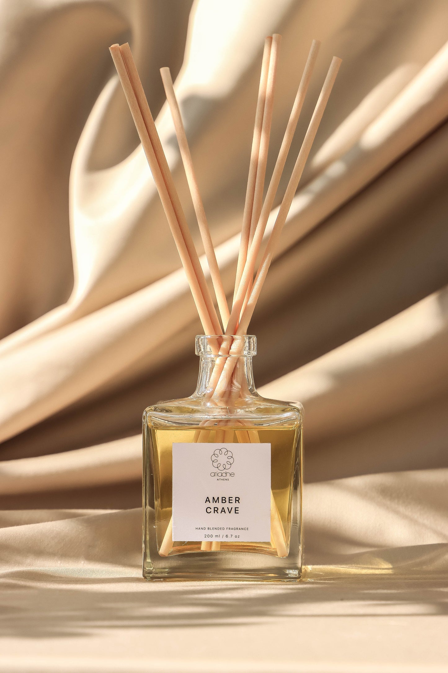Amber Crave Reed Diffuser with sticks front.
