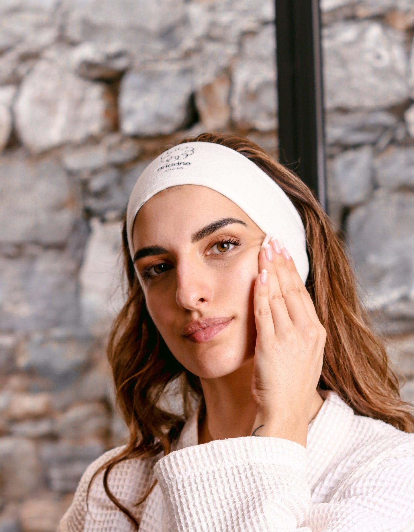 A woman using the Angel Face Cleansing Milk.